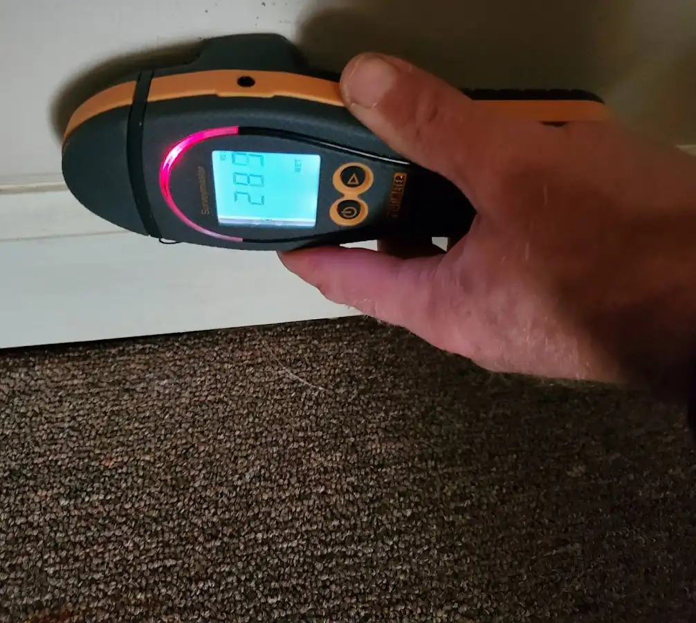 Moisture detection at baseboard during Storm Damage Restoration in Sodus